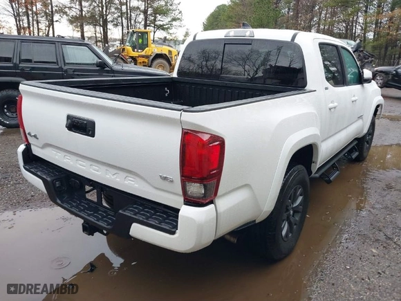 2023 Toyota Tacoma 4WD SR with VIN 3TMCZ5AN6PM633698, listed as a IAAI auction lot 41443892 with 13,214 mi miles. Bid and sale history available at carsss.com. Image 4.