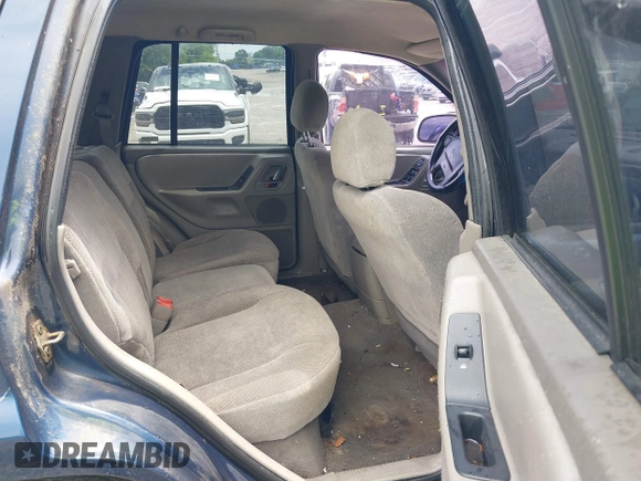 2000 Jeep Grand Cherokee Laredo z VIN 1J4GW48S9YC338947, wystawiony jako IAAI lot #42545830 z przebiegiem 234 251 mil mil oraz . Historia ofert i sprzedaży dostępna na DreamBid. Obrazek 8.