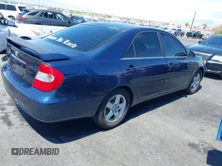 2003 Toyota Camry LE with VIN JTDBE32K130243265, listed as a IAAI auction lot 42145871 with Not Provided miles and . Bid and sale history available at DreamBid. Image 4.