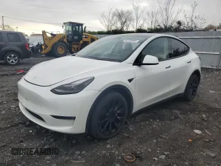 2023 Tesla Model Y Long Range with VIN 7SAYGDEE0PF746778, listed as a Copart auction lot 52704965 with 19,047 mi miles and Salvage Title. Bid and sale history available at DreamBid. Image 1.