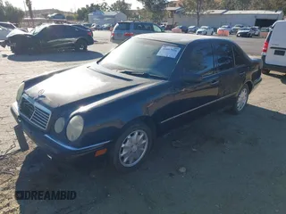 1997 Mercedes-Benz E-Class with VIN WDBJF55F6VJ032691, listed as a IAAI auction lot 40807926 with 215,262 mi miles. Bid and sale history available at carsss.com. Image 2.