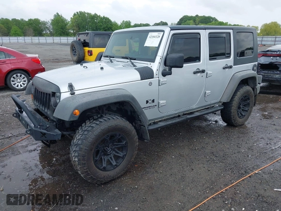 2007 Jeep Wrangler Unlimited X with VIN 1J4GA39187L209448, listed as a IAAI auction lot 42104328 with 138,302 mi miles and . Bid and sale history available at DreamBid. Image 18.
