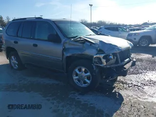 2003 GMC Envoy SLE with VIN 1GKDT13S732168534, listed as a IAAI auction lot 38049193 with 230,894 mi miles. Bid and sale history available at carsss.com. Image 1.