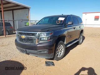 2015 Chevrolet Tahoe LS with VIN 1GNSCAKC9FR122896, listed as a IAAI auction lot 42239812 with 164,888 mi miles and . Bid and sale history available at DreamBid. Image 2.