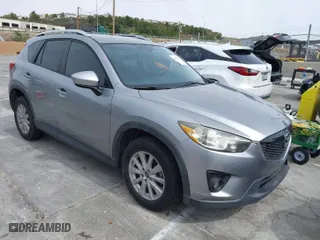 2014 Mazda CX-5 Touring with VIN JM3KE2CY3E0429025, listed as a IAAI auction lot 41680713 with 113,065 mi miles. Bid and sale history available at carsss.com. Image 1.