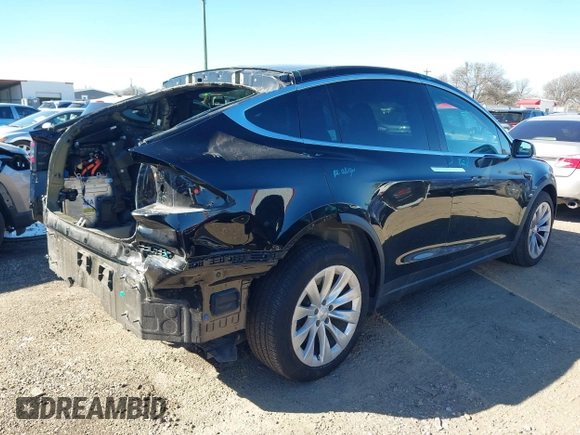2019 Tesla Model X 75D with VIN 5YJXCDE2XKF161371, listed as a IAAI auction lot 41174741 with 34,979 mi miles. Bid and sale history available at carsss.com. Image 4.