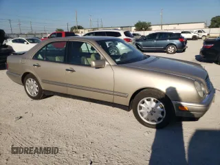 1996 Mercedes-Benz E-Class with VIN WDBJF55F7TJ022765, listed as a Copart auction lot 70577504 with 186,340 mi miles and Salvage Title. Bid and sale history available at carsss.com. Image 4.