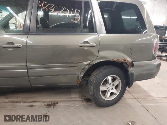 2007 Honda Pilot EX-L z VIN 2HKYF185X7H505077, wystawiony jako IAAI lot #42362215 z przebiegiem 174 592 mil mil oraz . Historia ofert i sprzedaży dostępna na DreamBid. Obrazek 6.