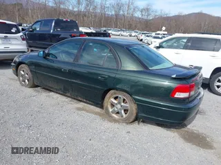2000 Cadillac Catera z VIN W06VR54R0YR002664, wystawiony jako IAAI lot #41857553 z przebiegiem 86 354 mil mil oraz . Historia ofert i sprzedaży dostępna na DreamBid. Obrazek 3.