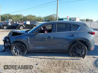 2021 Mazda CX-5 Touring with VIN JM3KFACM1M0371354, listed as a IAAI auction lot 40938490 with 56,172 mi miles. Bid and sale history available at carsss.com. Image 14.