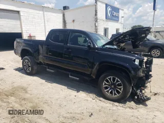 2020 Toyota Tacoma SR5 with VIN 3TMDZ5BN8LM090576, listed as a Copart auction lot 62217495 with 29,996 mi miles and Salvage title. Bid and sale history available at DreamBid. Image 4.