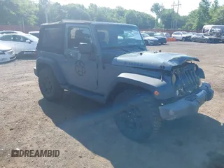 2015 Jeep Wrangler Freedom Edition z VIN 1C4AJWAG1FL714002, wystawiony jako IAAI lot #42579024 z przebiegiem 98 732 mil mil oraz . Historia ofert i sprzedaży dostępna na DreamBid. Obrazek 1.