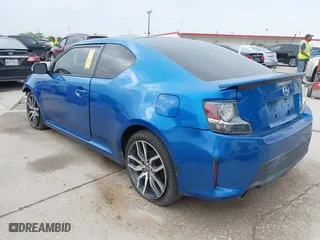 2014 Scion tC with VIN JTKJF5C77E3081277, listed as a IAAI auction lot 41932581 with 135,556 mi miles. Bid and sale history available at carsss.com. Image 3.
