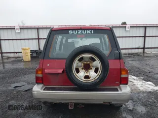 1996 Suzuki Sidekick z VIN JS3TD21V0T4107927, wystawiony jako IAAI lot #41249522 z przebiegiem 225 665 mil mil oraz . Historia ofert i sprzedaży dostępna na DreamBid. Obrazek 16.