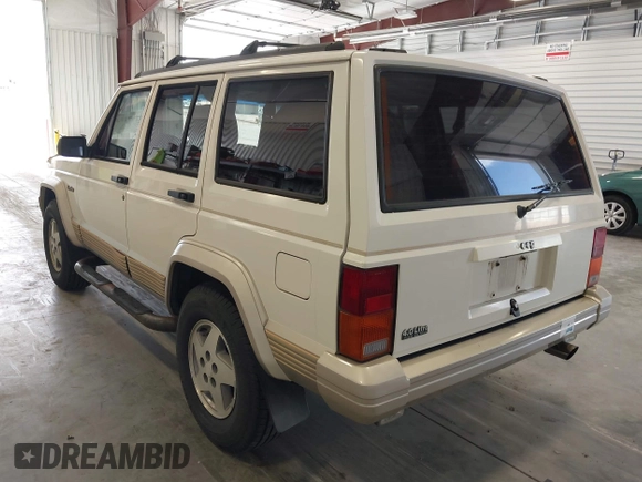 1996 Jeep Cherokee Country with VIN 1J4FT78S5TL232090, listed as a IAAI auction lot 42267272 with 255,417 mi miles and . Bid and sale history available at DreamBid. Image 3.