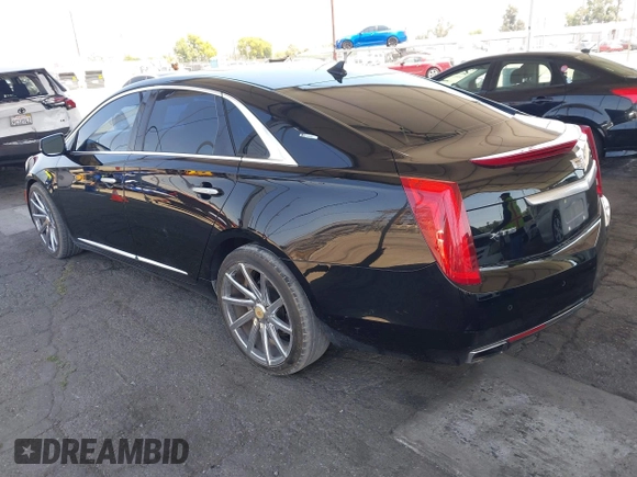 2013 Cadillac XTS Luxury with VIN 2G61P5S35D9105460, listed as a IAAI auction lot 42582313 with 144,895 mi miles and . Bid and sale history available at DreamBid. Image 3.