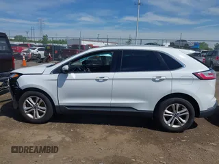 2020 Ford Edge SEL z VIN 2FMPK4J90LBA28960, wystawiony jako IAAI lot #42264189 z przebiegiem 91 312 mil mil oraz . Historia ofert i sprzedaży dostępna na DreamBid. Obrazek 14.
