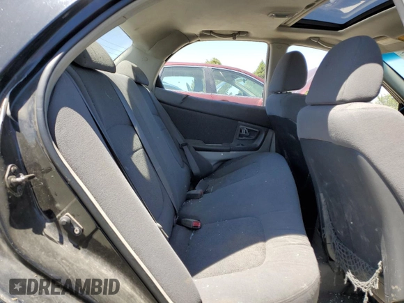 2005 Kia Spectra LX with VIN KNAFE121255156796, listed as a Copart auction lot 58595684 with 197,792 mi miles and Salvage Title. Bid and sale history available at carsss.com. Image 10.