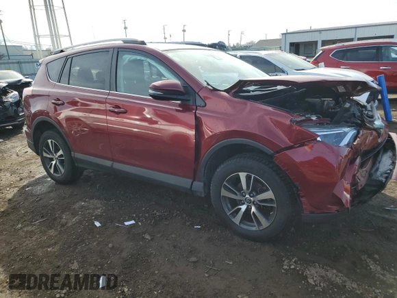 2018 Toyota RAV4 XLE with VIN 2T3RFREV0JW725903, listed as a Copart auction lot 48519955 with 55,056 mi miles and Salvage Title. Bid and sale history available at DreamBid. Image 4.