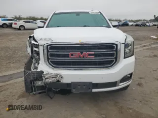 2015 GMC Yukon SLE with VIN 1GKS1AKC8FR733084, listed as a Copart auction lot 82960064 with 163,576 mi miles and Salvage Title. Bid and sale history available at carsss.com. Image 5.
