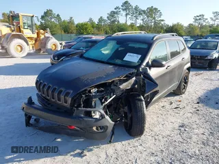2018 Jeep Cherokee Trailhawk with VIN 1C4PJMBX7JD517299, listed as a IAAI auction lot 42022770 with 62,865 mi miles. Bid and sale history available at carsss.com. Image 2.