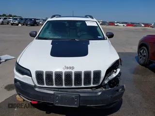 2021 Jeep Cherokee Trailhawk with VIN 1C4PJMBX1MD145169, listed as a IAAI auction lot 42340464 with 50,925 mi miles and . Bid and sale history available at DreamBid. Image 6.