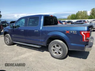 2015 Ford F-150 XLT with VIN 1FTEW1EP7FKE12574, listed as a Copart auction lot 59519985 with 133,337 mi miles and Salvage title. Bid and sale history available at DreamBid. Image 2.