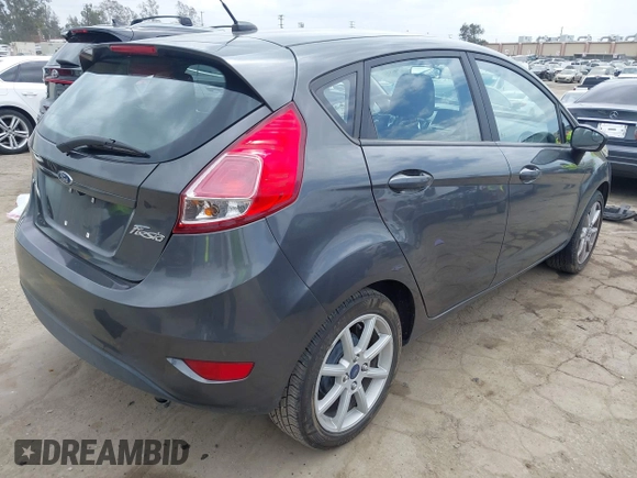 2018 Ford Fiesta SE with VIN 3FADP4EJ7JM127256, listed as a IAAI auction lot 41938121 with 83,211 mi miles. Bid and sale history available at carsss.com. Image 4.