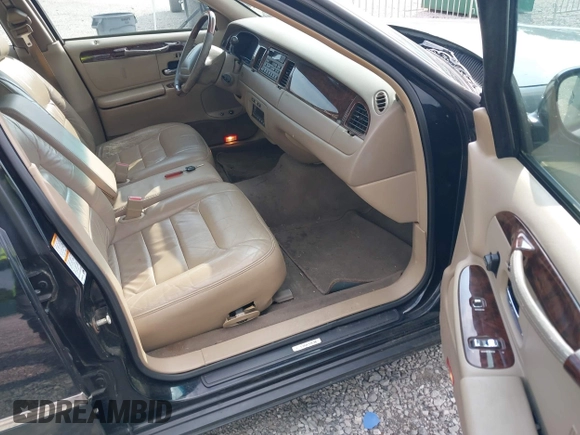2001 Lincoln Town Car Signature with VIN 1LNHM82W11Y613959, listed as a IAAI auction lot 42432229 with 144,660 mi miles and . Bid and sale history available at DreamBid. Image 5.
