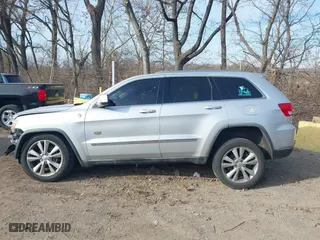 2011 Jeep Grand Cherokee Laredo with VIN 1J4RR4GTXBC678304, listed as a IAAI auction lot 41088309 with 139,559 mi miles. Bid and sale history available at carsss.com. Image 14.