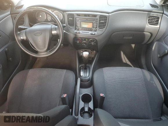 2009 Kia Rio LX with VIN KNADE223296515613, listed as a Copart auction lot 62008194 with 143,238 mi miles and Salvage Title. Bid and sale history available at carsss.com. Image 8.
