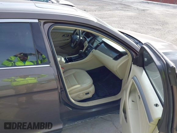 2015 Ford Taurus SEL with VIN 1FAHP2H87FG199865, listed as a IAAI auction lot 40760225 with 77,782 mi miles. Bid and sale history available at carsss.com. Image 5.