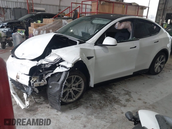 2023 Tesla Model Y Long Range z VIN 7SAYGAEEXPF789037, wystawiony jako IAAI lot #41551605 z przebiegiem 8 630 mil mil oraz . Historia ofert i sprzedaży dostępna na DreamBid. Obrazek 17.