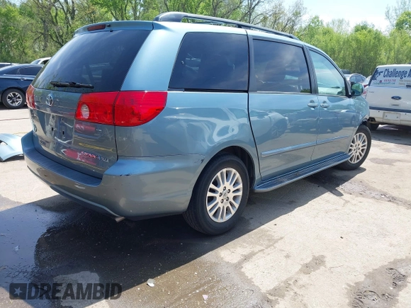 2009 Toyota Sienna XLE with VIN 5TDZK22C99S239755, listed as a IAAI auction lot 42096411 with 214,983 mi miles. Bid and sale history available at carsss.com. Image 4.