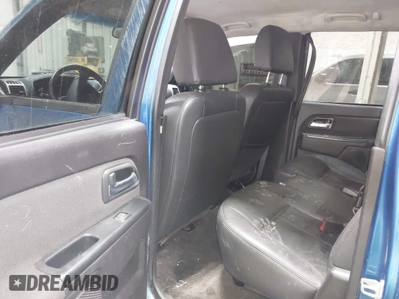 2011 GMC Canyon SLT with VIN 1GTH6NFP8B8115436, listed as a IAAI auction lot 41676023 with 148,478 mi miles. Bid and sale history available at carsss.com. Image 8.