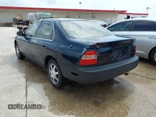 1994 Honda Accord EX with VIN 1HGCD5654RA042441, listed as a IAAI auction lot 42129570 with 121,220 mi miles and . Bid and sale history available at carsss.com. Image 3.