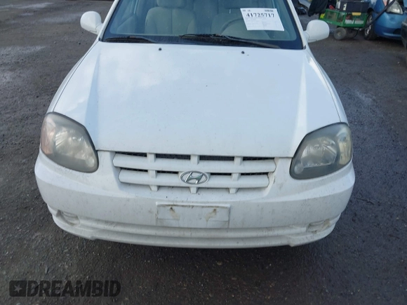 2004 Hyundai Accent GL with VIN KMHCG35C74U303431, listed as a IAAI auction lot 41725717 with 211,893 mi miles. Bid and sale history available at carsss.com. Image 6.