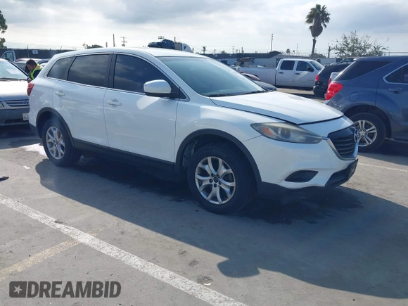 2015 Mazda CX-9 Sport with VIN JM3TB2BAXF0453244, listed as a IAAI auction lot 41905847 with 128,764 mi miles and . Bid and sale history available at carsss.com. Image 1.
