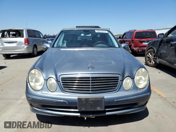 2004 Mercedes-Benz E-Class 5.0L with VIN WDBUF70JX4A479530, listed as a Copart auction lot 68093214 with 165,986 mi miles and Clean Title. Bid and sale history available at carsss.com. Image 5.