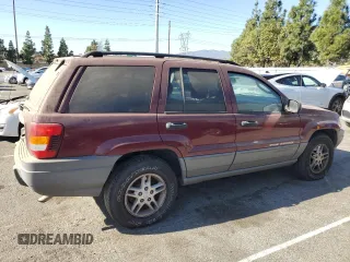2002 Jeep Grand Cherokee Laredo with VIN 1J4GX48S52C265385, listed as a Copart auction lot 88823385 with 225,106 mi miles and Clean title. Bid and sale history available at DreamBid. Image 3.