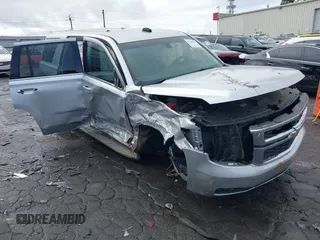 2015 Chevrolet Tahoe Commercial z VIN 1GNLC2EC9FR274389, wystawiony jako IAAI lot #41370953 z przebiegiem 236 078 mil mil oraz . Historia ofert i sprzedaży dostępna na DreamBid. Obrazek 1.