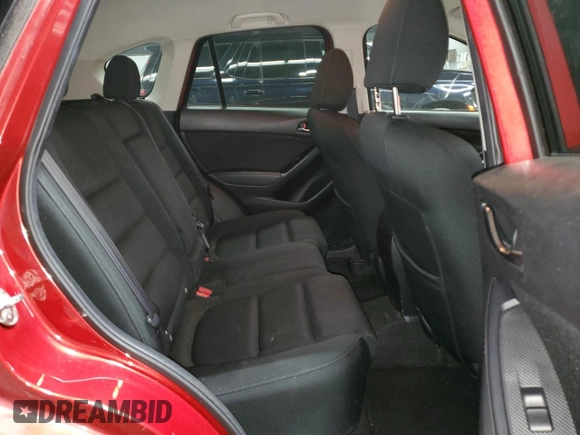 2016 Mazda CX-5 Touring z VIN JM3KE4CY6G0647362, wystawiony jako Copart lot #58081855 z przebiegiem 86 372 mil mil oraz Szkoda całkowita • Salvage title. Historia ofert i sprzedaży dostępna na DreamBid. Obrazek 11.