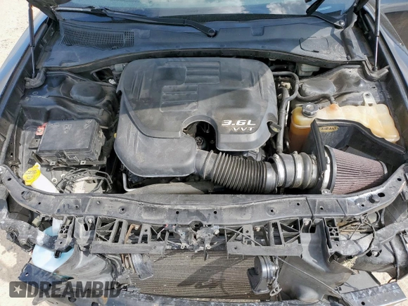 2015 Dodge Charger SXT with VIN 2C3CDXHG7FH721825, listed as a Copart auction lot 58076255 with 193,740 mi miles and Salvage title. Bid and sale history available at DreamBid. Image 11.