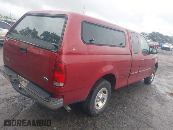 2000 Ford F-150 XL with VIN 1FTRX17W5YNB91724, listed as a IAAI auction lot 41954818 with 156,718 mi miles. Bid and sale history available at carsss.com. Image 4.