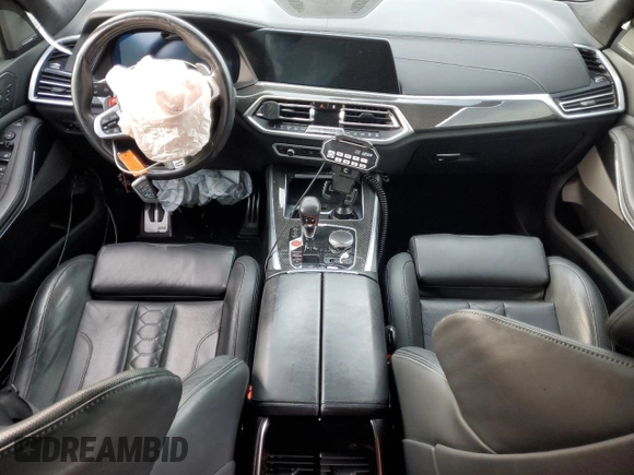 2021 BMW X5 M z VIN 5YMJU0C04M9F64315, wystawiony jako Copart lot #82029464 z przebiegiem Nie podano mil oraz Szkoda całkowita • Salvage title. Historia ofert i sprzedaży dostępna na DreamBid. Obrazek 8.