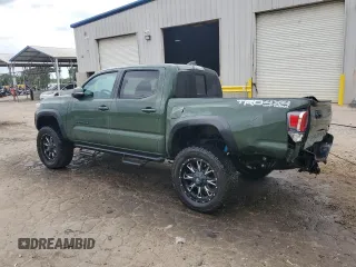 2021 Toyota Tacoma SR with VIN 3TYCZ5AN9MT010768, listed as a Copart auction lot 53961455 with 55,822 mi miles and Salvage title. Bid and sale history available at DreamBid. Image 2.