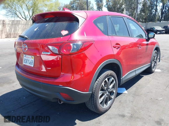 2016 Mazda CX-5 Grand Touring z VIN JM3KE2DY2G0660385, wystawiony jako IAAI lot #42101004 z przebiegiem 166 336 mil mil oraz . Historia ofert i sprzedaży dostępna na DreamBid. Obrazek 4.