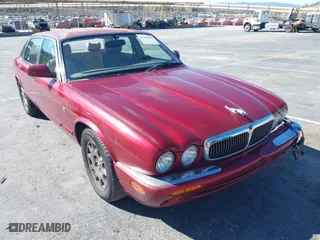 1998 Jaguar XJ with VIN SAJHX1243WC813314, listed as a IAAI auction lot 41332965 with 1 mi miles. Bid and sale history available at carsss.com. Image 1.