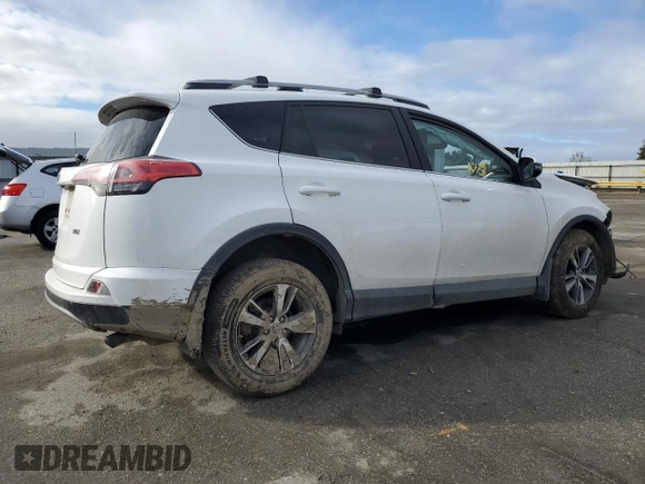 2018 Toyota RAV4 XLE with VIN 2T3WFREV1JW471752, listed as a Copart auction lot 46952565 with 87,705 mi miles and Salvage Title. Bid and sale history available at DreamBid. Image 3.