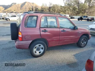 1999 Suzuki Vitara JX z VIN 2S3TD52V6X6101702, wystawiony jako Copart lot #42596125 z przebiegiem 225 614 mil mil oraz Tytuł czysty. Historia ofert i sprzedaży dostępna na DreamBid. Obrazek 3.